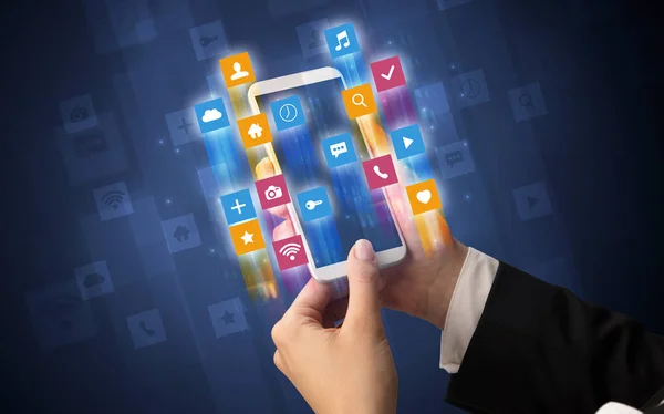 Hand using smartphone with angular app icons — Stock Photo, Image