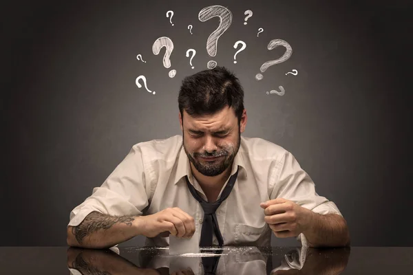 Drunk disappointed man with question signs concept — Stock Photo, Image