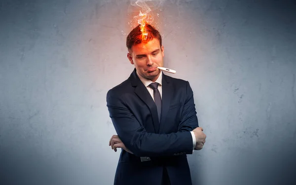 Sick businessman with burning head concept — Stock Photo, Image