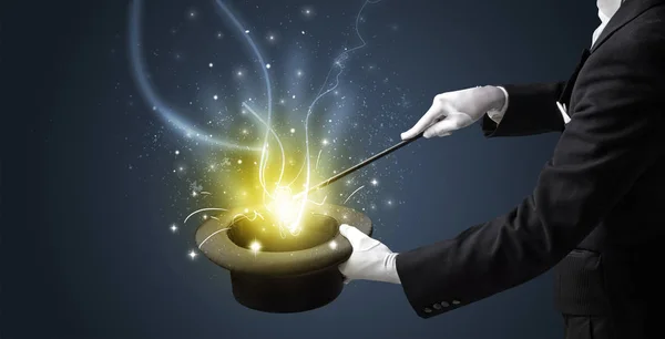 Magician hand conjure miracle from cylinder — Stock Photo, Image