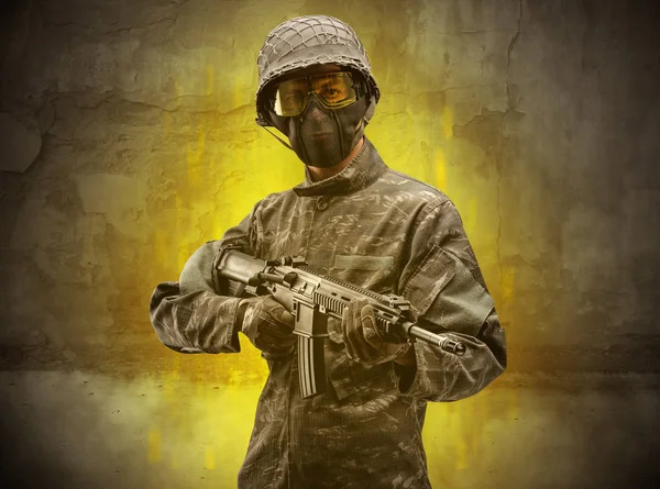 Ruined wallpaper with hazard soldier — Stock Photo, Image