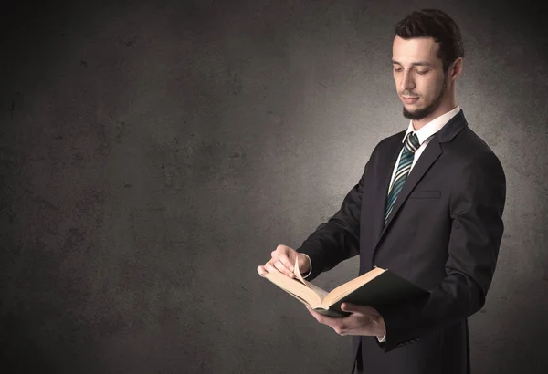 Businessman holding a book. — Stock Photo, Image