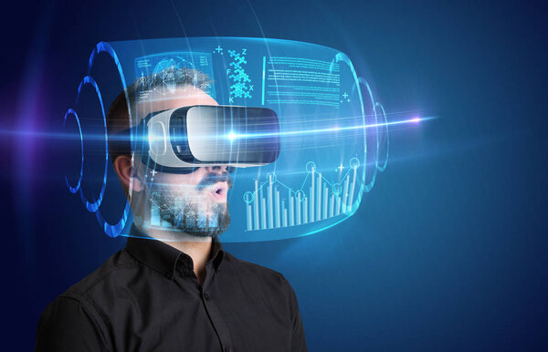 Amazed businessman with high tech 3D projection in front of him 