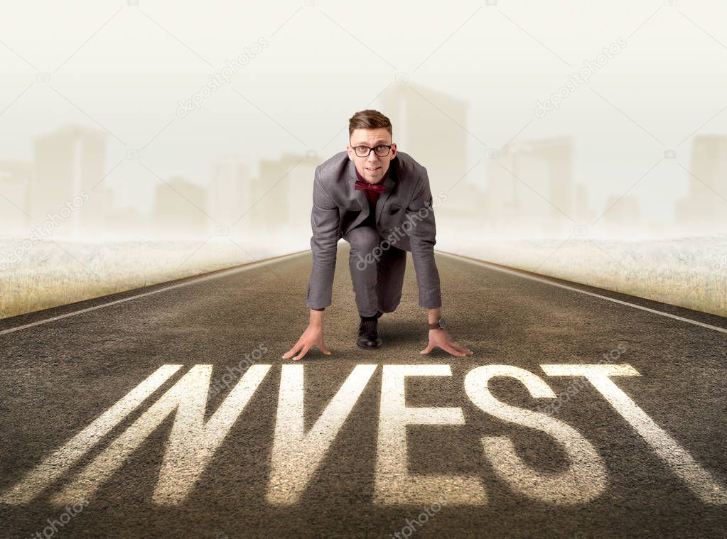 Businessman kneeling in ready position