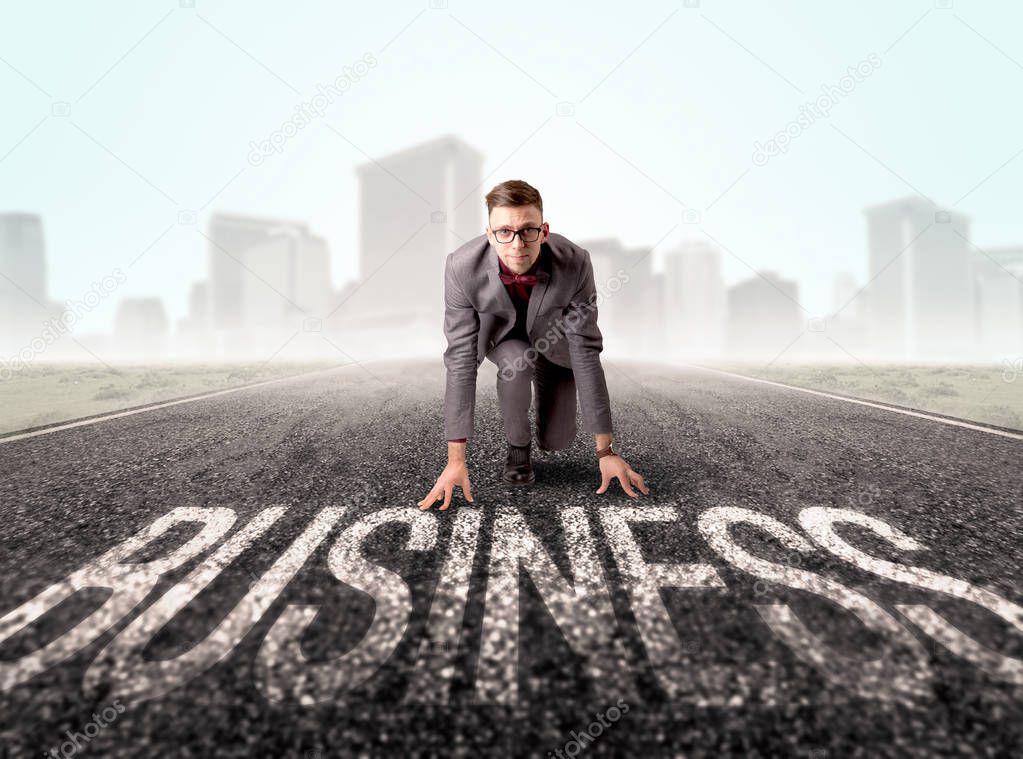 Businessman at start line