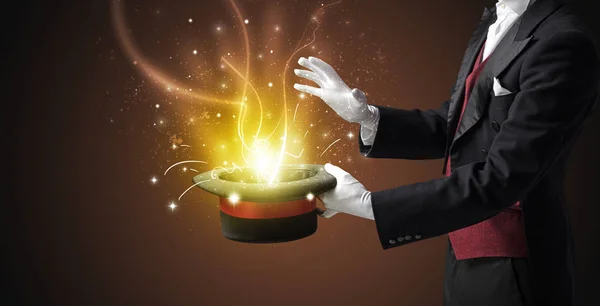 Magician hand conjure miracle from cylinder — Stock Photo, Image