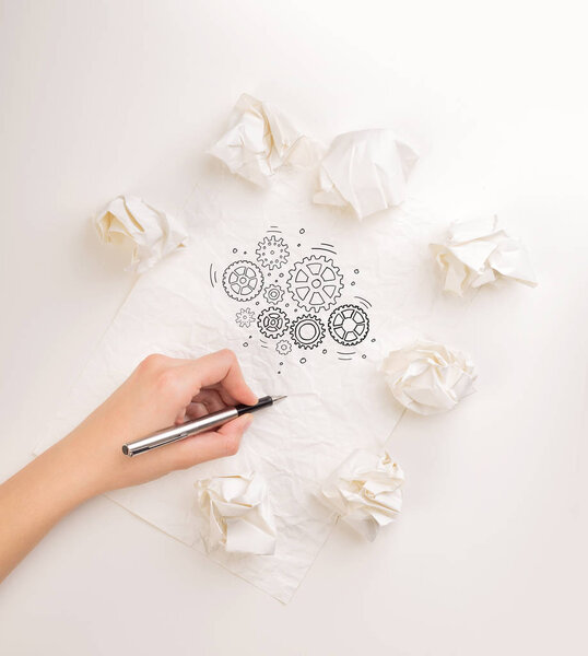 Writing hand in crumpled paper