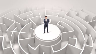 Businessman standing on the top of a maze clipart