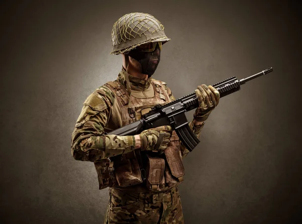 Soldier agent in a dark space with arms — Stock Photo, Image