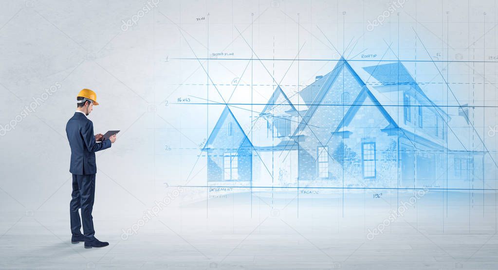 Architect standing with house plan