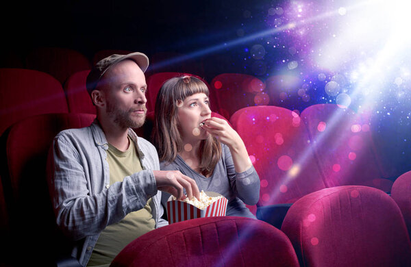 Romantic couple sitting at spectacle