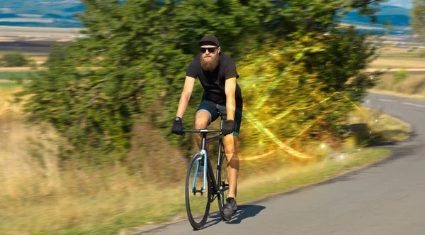 Magical young cyclist riding — Stock Photo, Image