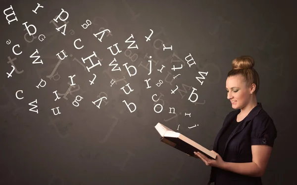 Young lady holding book with letters — Stock Photo, Image