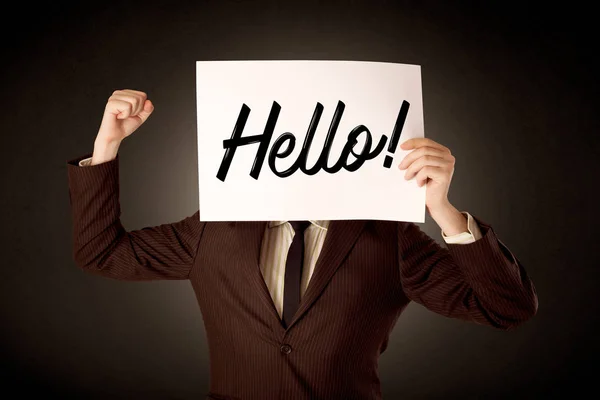 Businessman holding paper with greeting — Stock Photo, Image