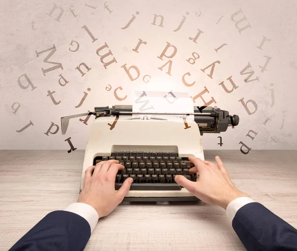 First person perspective elegant hand typing with flying letters concept — Stock Photo, Image