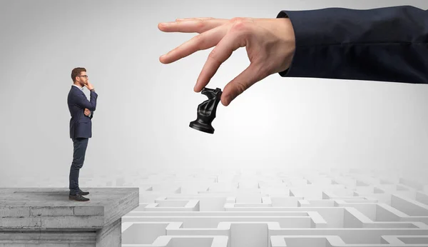 Little businessman from the top of the labyrinth thinking about strategies — Stock Photo, Image