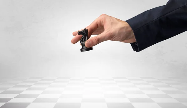 Big hand taking his next step on chess game — Stock Photo, Image