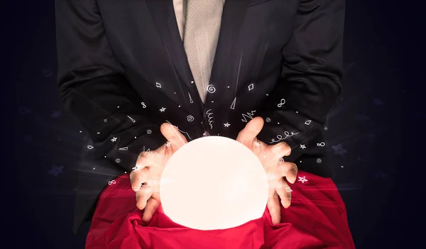 Businessman looking to inspiration in a magic ball and doodle concept — Stock Photo, Image