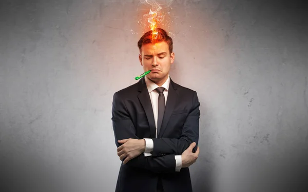 Uomo d'affari malato con concetto di testa in fiamme — Foto Stock