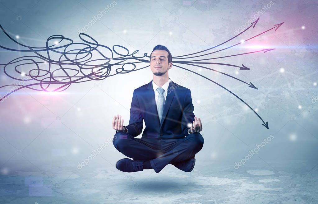 Businessman levitates in yoga position and systematize with thinking concept