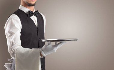 Waiter serving with white gloves and steel tray clipart