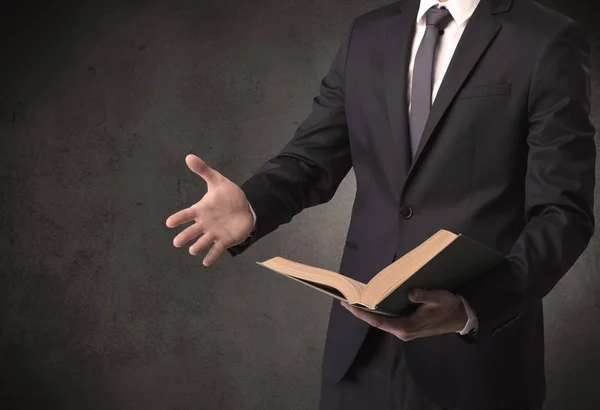 Businessman holding a book. — Stock Photo, Image