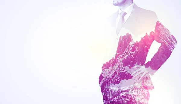 Businessman standing with mountain graphic — Stock Photo, Image