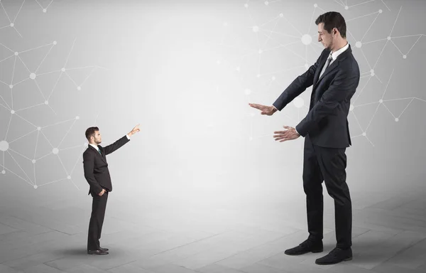 Small man aiming at a big man with network concept — Stock Photo, Image