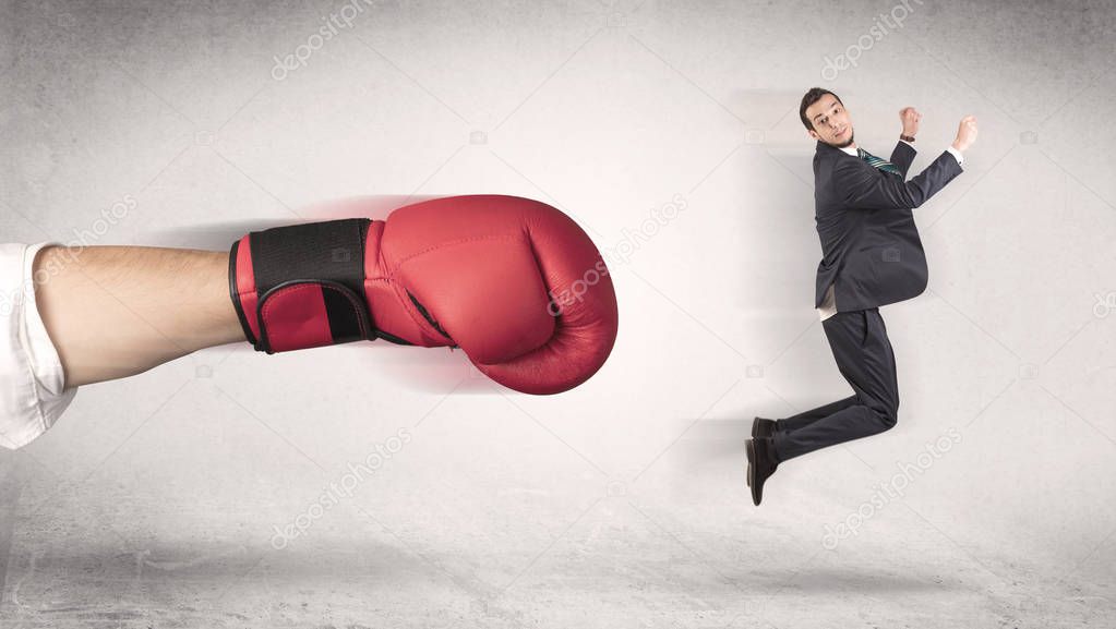 Businessman gets fired by a huge boxing hand