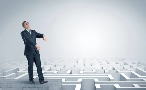 Sleepy businessman on the top of a labyrinth — Stock Photo, Image