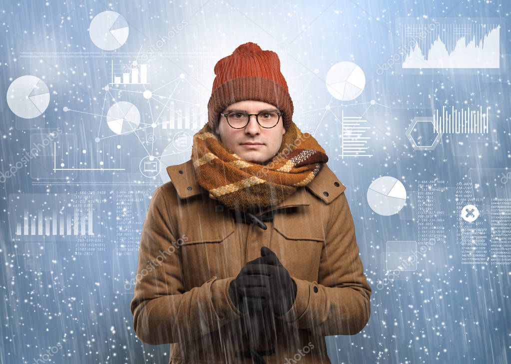 Young hipster shivering with graphs, reports and chart concept