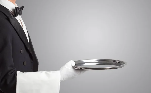 Waiter serving with white gloves and steel tray — Stock Photo, Image