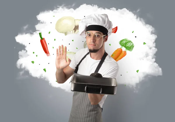 Légumes sur nuage avec cuisinier masculin — Photo