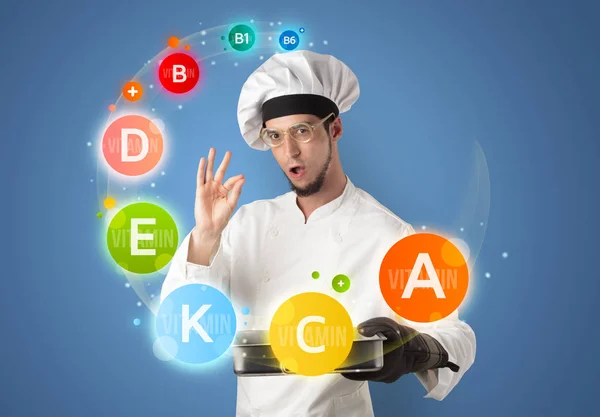 Handsome cook with vitamin concept — Stock Photo, Image