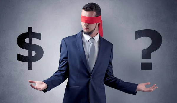 Man with ribbon on his eye holding dollar signs — Stock Photo, Image