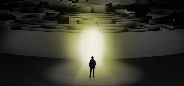 Businessman starting a concentric labyrinth — Stock Photo, Image