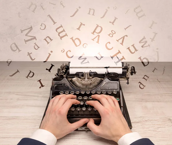 First person perspective elegant hand typing with flying letters concept — Stock Photo, Image