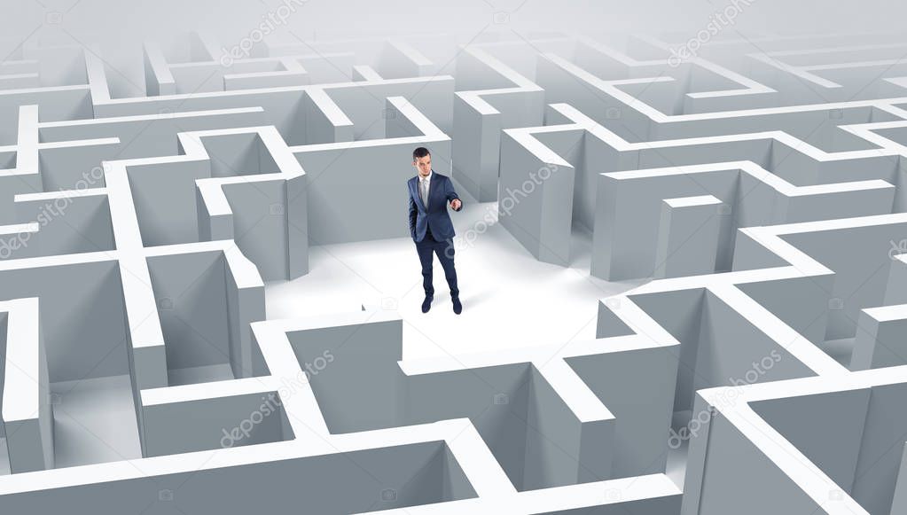 Businessman standing in a middle of a maze