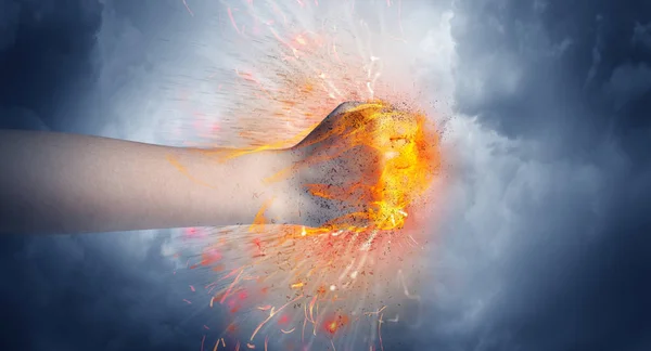 Hand hits intense and makes fire — Stock Photo, Image