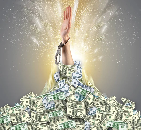 Hand bursting from a money heap — Stock Photo, Image