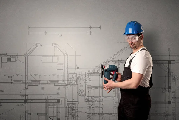 Worker with technical drawing. — Stock Photo, Image