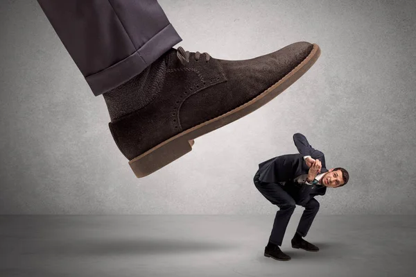 Employee afraid of the big boss foot — Stock Photo, Image