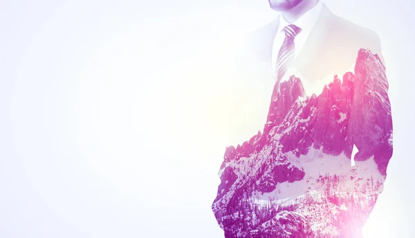 Businessman standing with mountain graphic — Stock Photo, Image