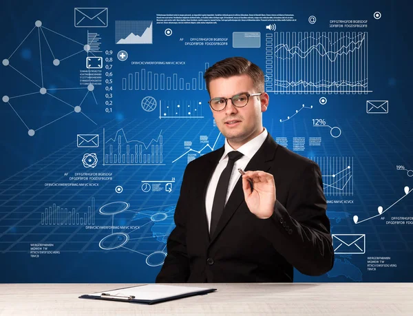 Businessman sitting at a desk — Stock Photo, Image