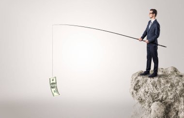 İşadamı Balık tutma Doları bir rock