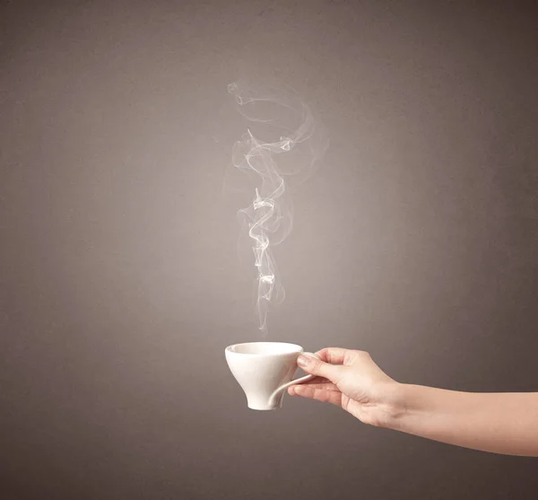 Female hand holding coffee cup — Stock Photo, Image