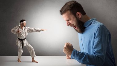 Giant man yelling at a small karate man clipart