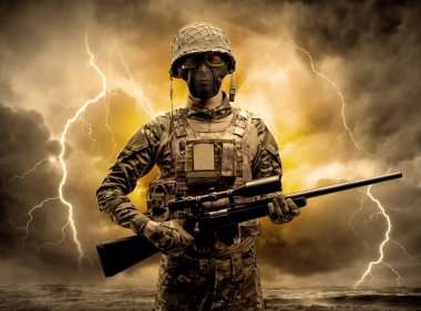 Silahlı asker anlaşılması güç bir havada duran