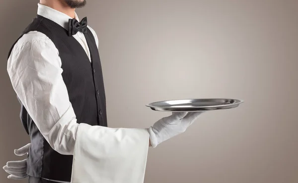 Waiter serving with white gloves and steel tray — Stock Photo, Image