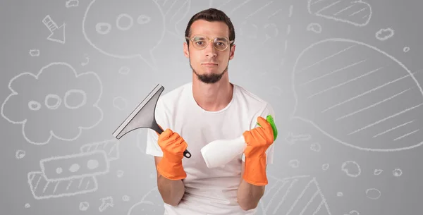 Male housekeeper with grey doodled wallpaper — Stock Photo, Image